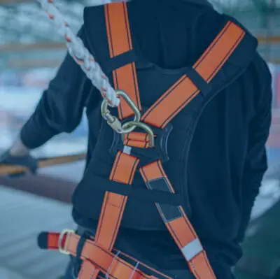 Worker wearing a safety harness
